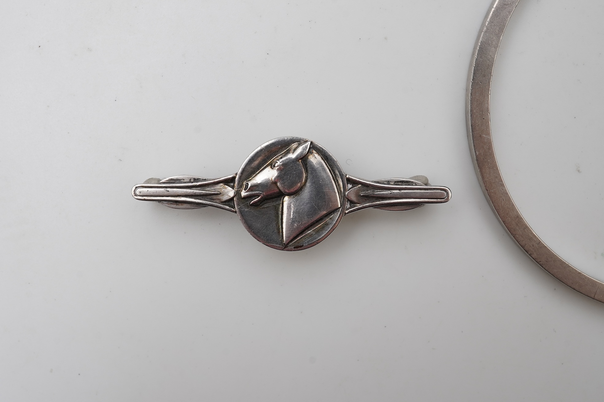 Georg Jensen, a bangle, circa 1964, and brooch, second half 20th century